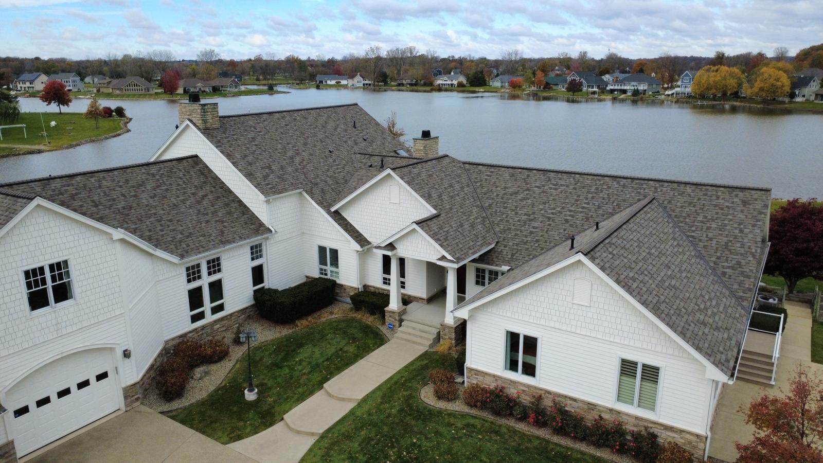 Billy White Roofing aerial view of a completed roof replacement in Michigan